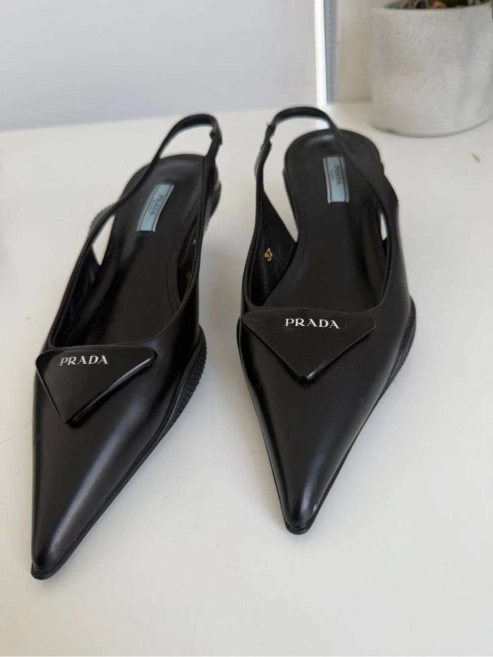 Prada Black Pointed Slingback Pumps with Logo Plaque